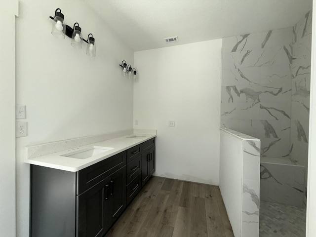 1575 Pine St, Niceville, FL 32578 - bathroom with wood finished floors, double vanity, and a marble finish shower