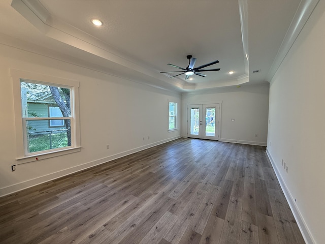 1575 Pine St, Niceville, FL 32578 - spare room with a raised ceiling, ornamental molding, a ceiling fan, wood finished floors, and baseboards