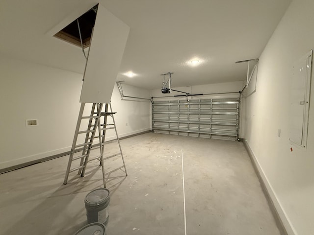 1575 Pine St, Niceville, FL 32578 - garage featuring a garage door opener, baseboards, and electric panel