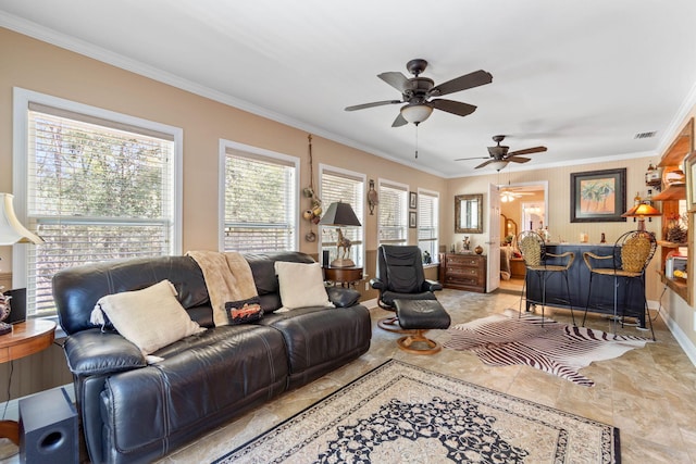 living room featuring ornamental molding, bar, visible vents, and baseboards