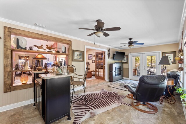 living area featuring visible vents, ornamental molding, baseboards, and french doors