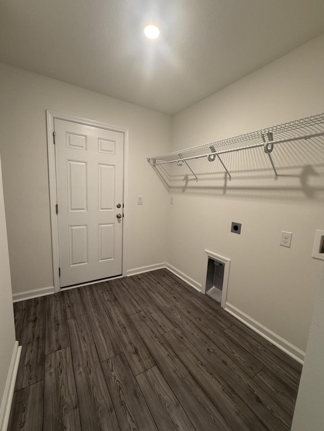 laundry room with electric dryer hookup, dark wood-type flooring, baseboards, hookup for a washing machine, and laundry area