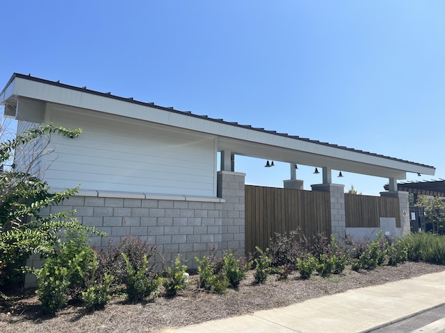 view of property exterior featuring fence