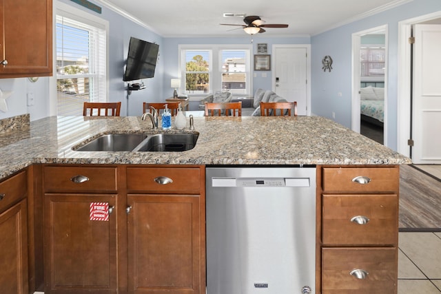 kitchen featuring a sink, crown molding, a peninsula, and dishwasher