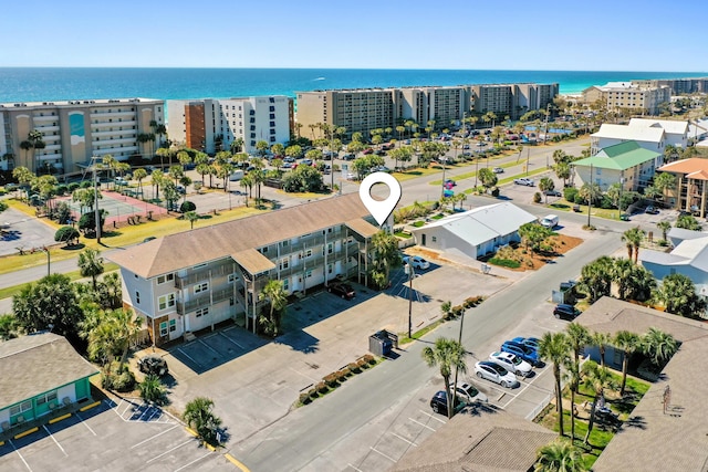 birds eye view of property featuring a view of city and a water view