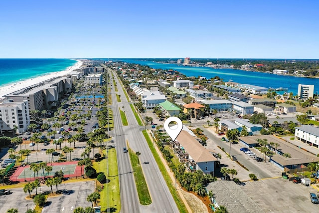 birds eye view of property featuring a view of the beach and a water view