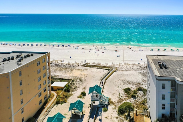 exterior space with a water view and a view of the beach