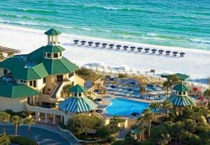 bird's eye view with a water view and a view of the beach