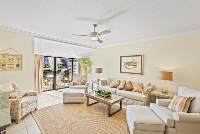 living room featuring crown molding, light tile patterned flooring, a ceiling fan, and a textured ceiling