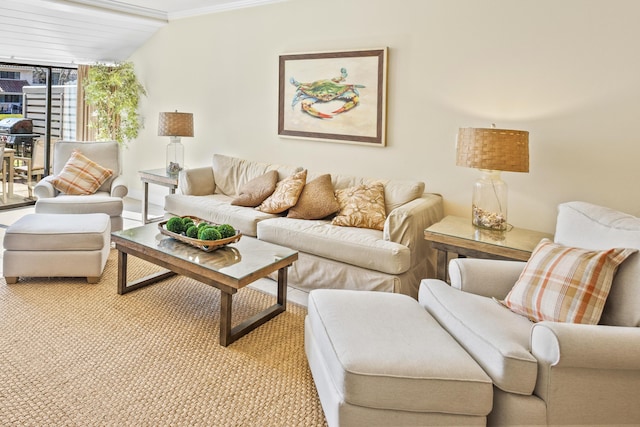 living area with light carpet and crown molding