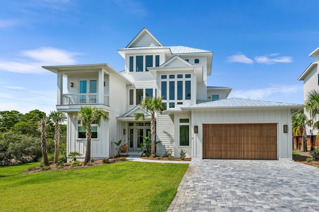 view of front of home featuring a standing seam roof, board and batten siding, and an attached garage