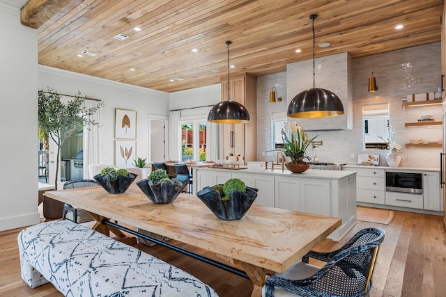 dining room with recessed lighting, wooden ceiling, light wood-style flooring, and baseboards