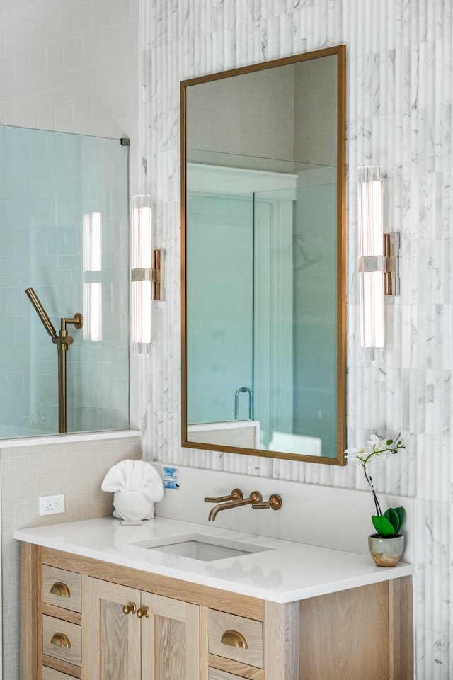 bathroom with tile walls and vanity