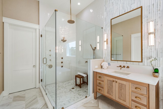 bathroom featuring a stall shower and vanity