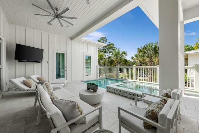 view of patio / terrace with ceiling fan, an outdoor hangout area, and a fenced in pool