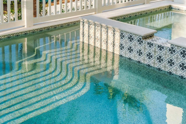 view of pool featuring a hot tub