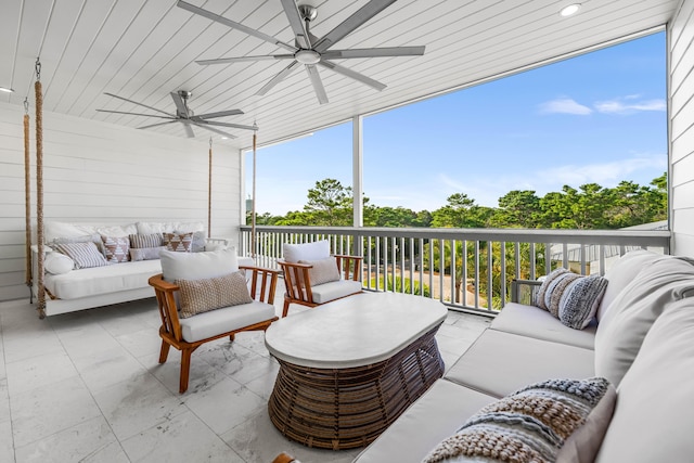 sunroom / solarium featuring wooden ceiling and a ceiling fan