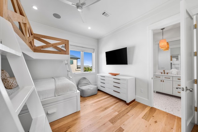 bedroom with light wood finished floors, recessed lighting, visible vents, and crown molding