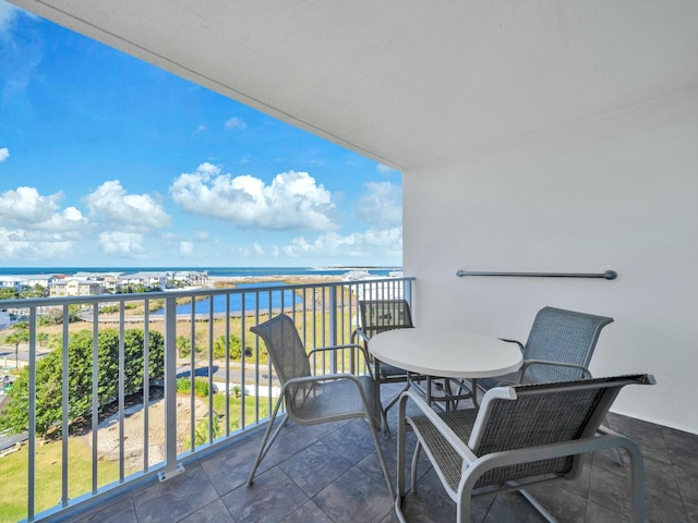 balcony featuring a water view