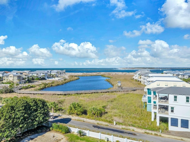 drone / aerial view with a residential view and a water view