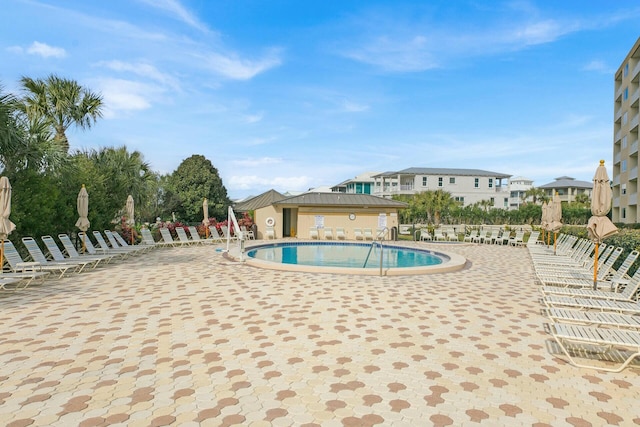 pool with a patio area