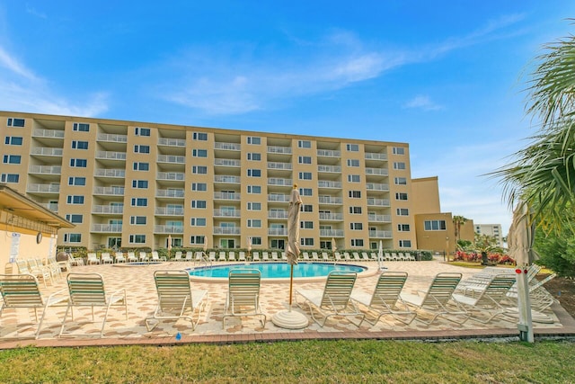 community pool featuring a patio area