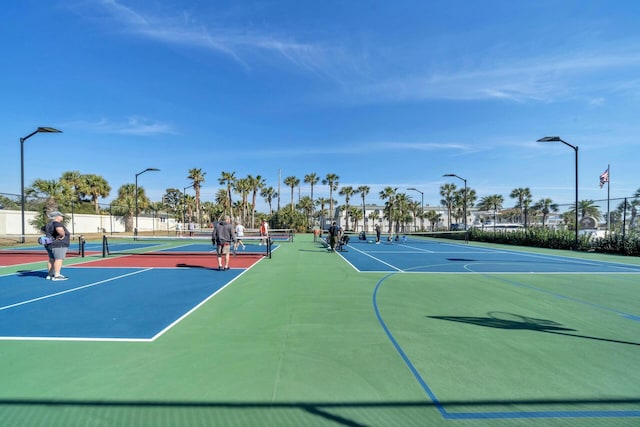 view of sport court featuring community basketball court and fence