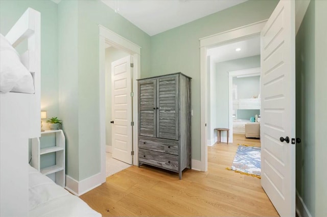 interior space with light wood-type flooring and baseboards