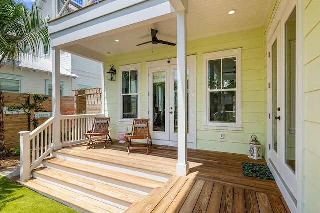 wooden deck featuring ceiling fan and covered porch