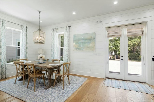 dining area featuring light wood-style floors, recessed lighting, a wealth of natural light, and french doors