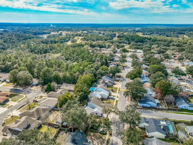 drone / aerial view with a view of trees and a residential view