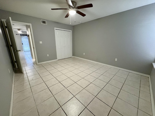 unfurnished bedroom featuring a closet, visible vents, ceiling fan, and baseboards