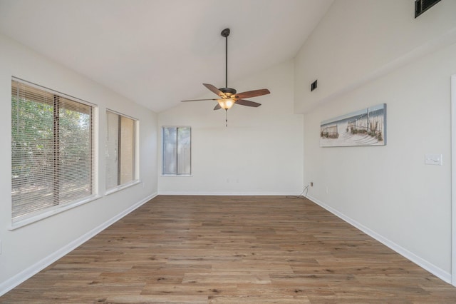 empty room featuring visible vents, baseboards, wood finished floors, and a ceiling fan