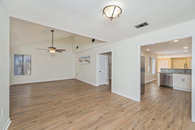 unfurnished living room with visible vents, baseboards, light wood-type flooring, lofted ceiling, and a ceiling fan