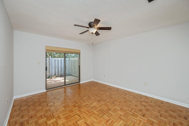 unfurnished room featuring baseboards and a ceiling fan