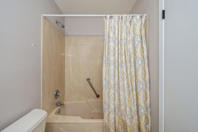 full bathroom featuring toilet and shower / bath combination with curtain