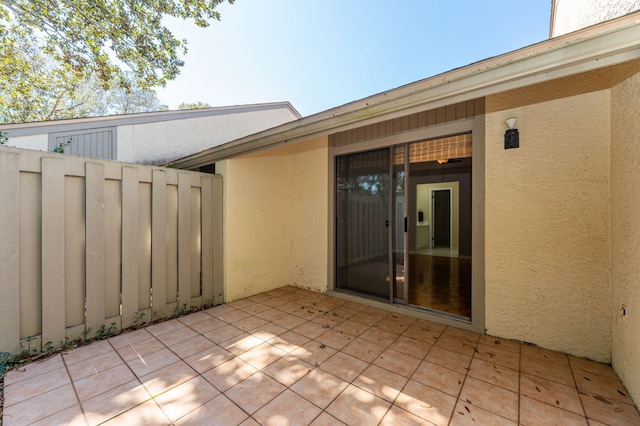 view of patio / terrace featuring fence