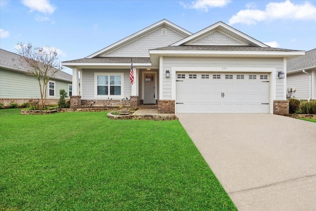 craftsman house featuring brick siding, an attached garage, concrete driveway, and a front lawn