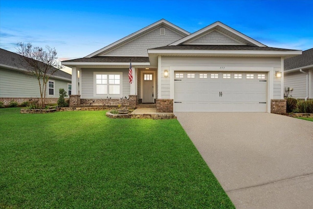 view of front facade featuring a garage, brick siding, concrete driveway, and a front lawn