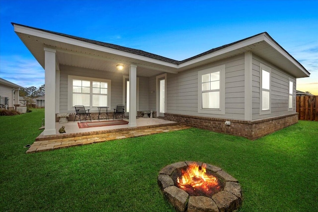 back of property featuring a patio area, a lawn, central AC, and fence