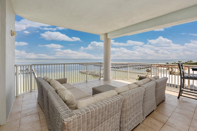 balcony featuring an outdoor hangout area and a water view