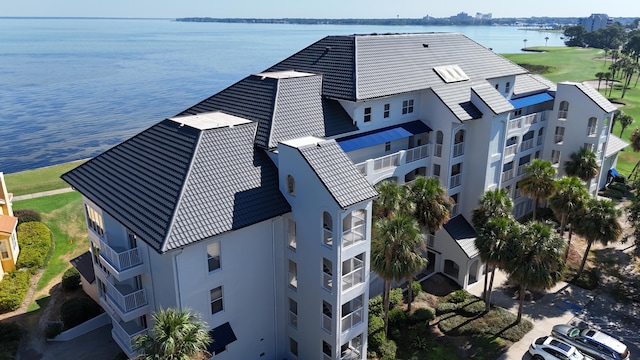 birds eye view of property with a water view