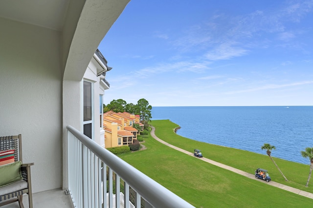 balcony featuring a water view