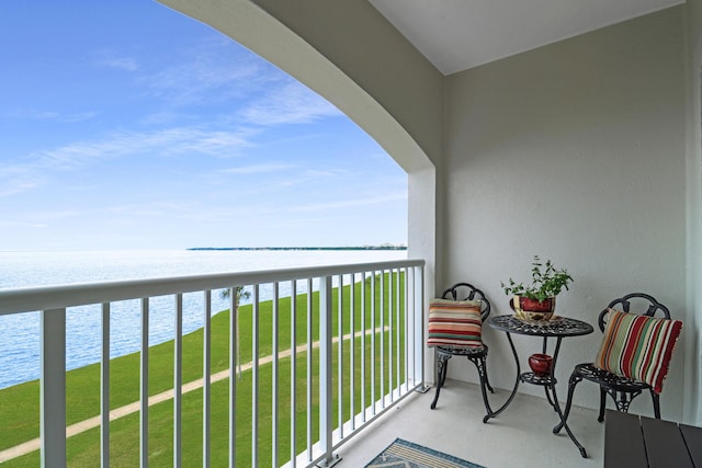 balcony featuring a water view