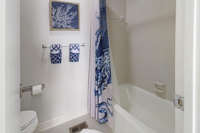 bathroom featuring tile patterned flooring, visible vents, baseboards, toilet, and shower / bathtub combination with curtain