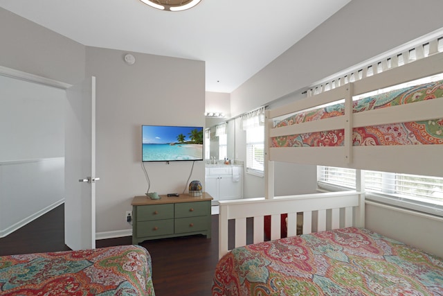 bedroom with dark wood-style flooring