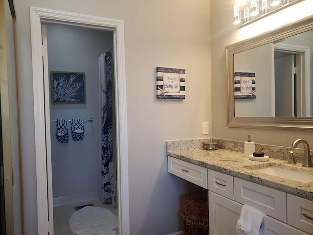 25 Players Clb Unit 25, Miramar Beach, FL 32550 - bathroom with baseboards, a shower with curtain, and vanity