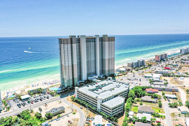 bird's eye view featuring a view of city, a beach view, and a water view