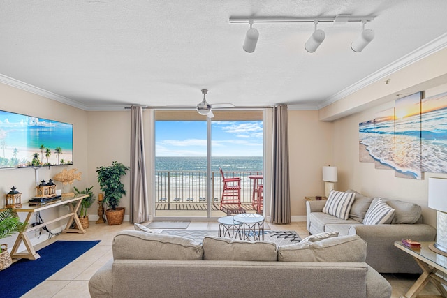 tiled living room featuring a textured ceiling and crown molding