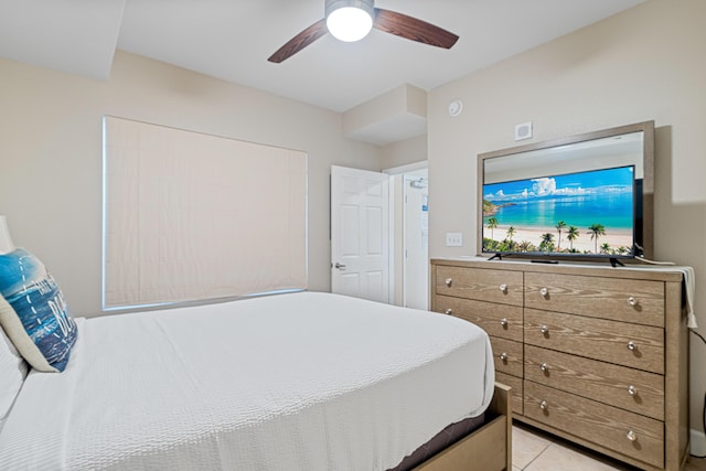 bedroom featuring light tile patterned floors and ceiling fan